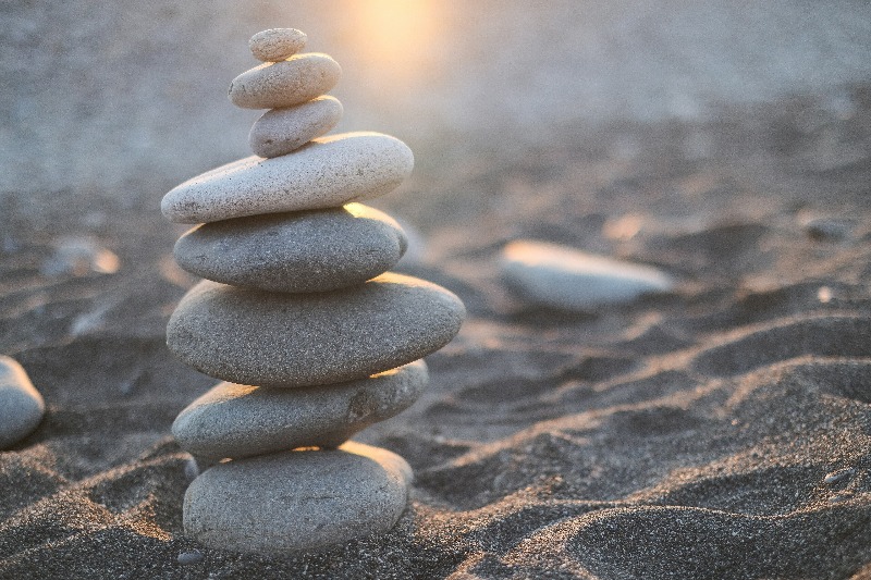 pebbles balanced on a beach