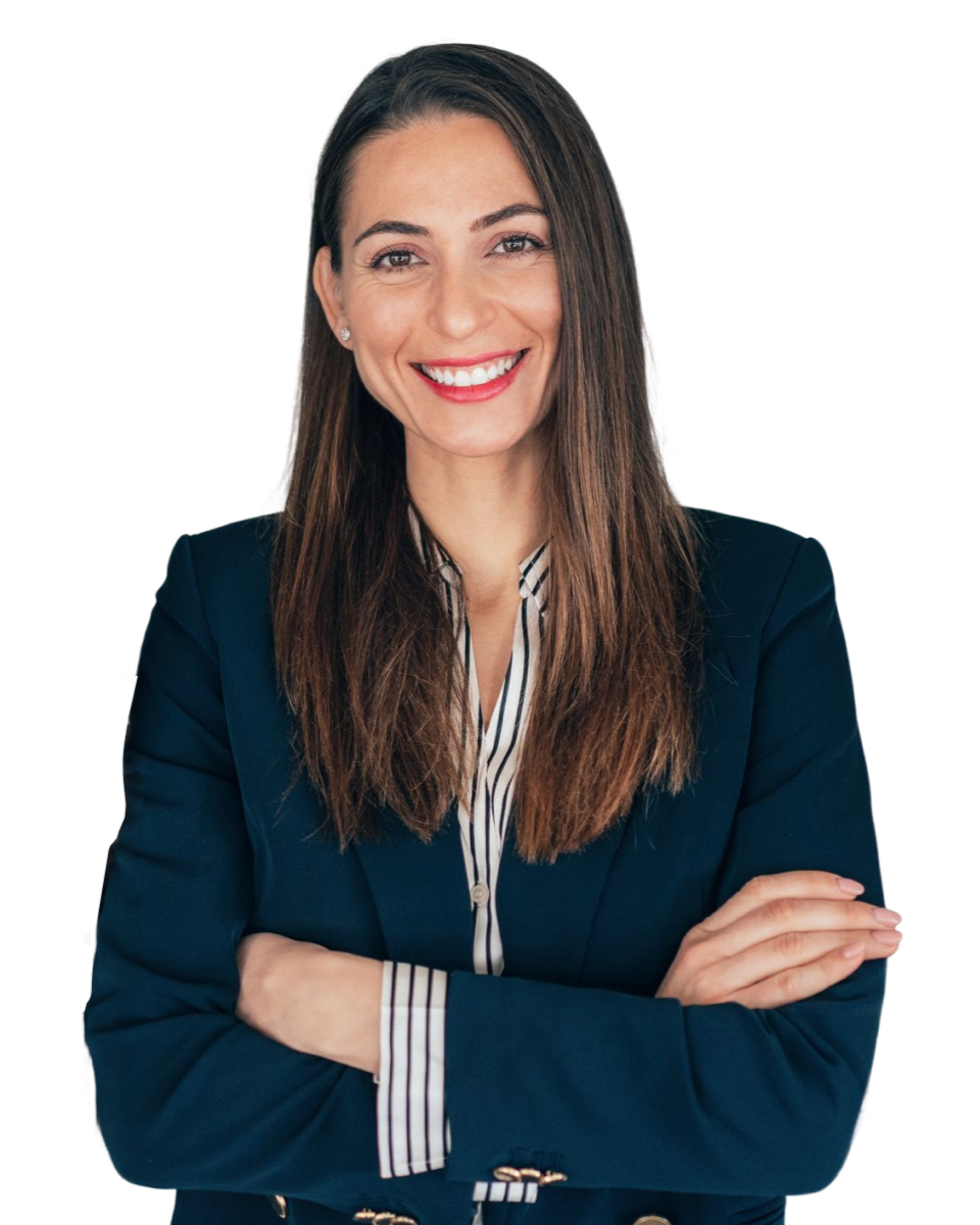 Smiling female professional with arms folded.