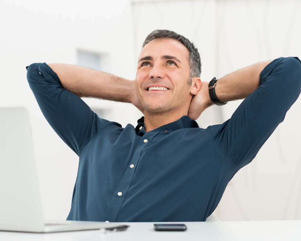 Man relaxing at his desk