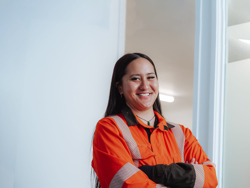 Female smiling while crossing arms