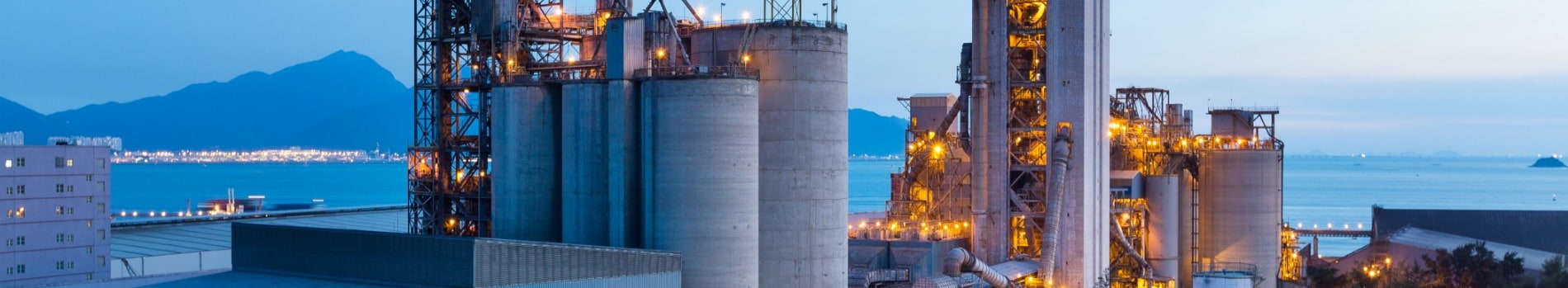 Oil and gas large cement factory with mountain in background