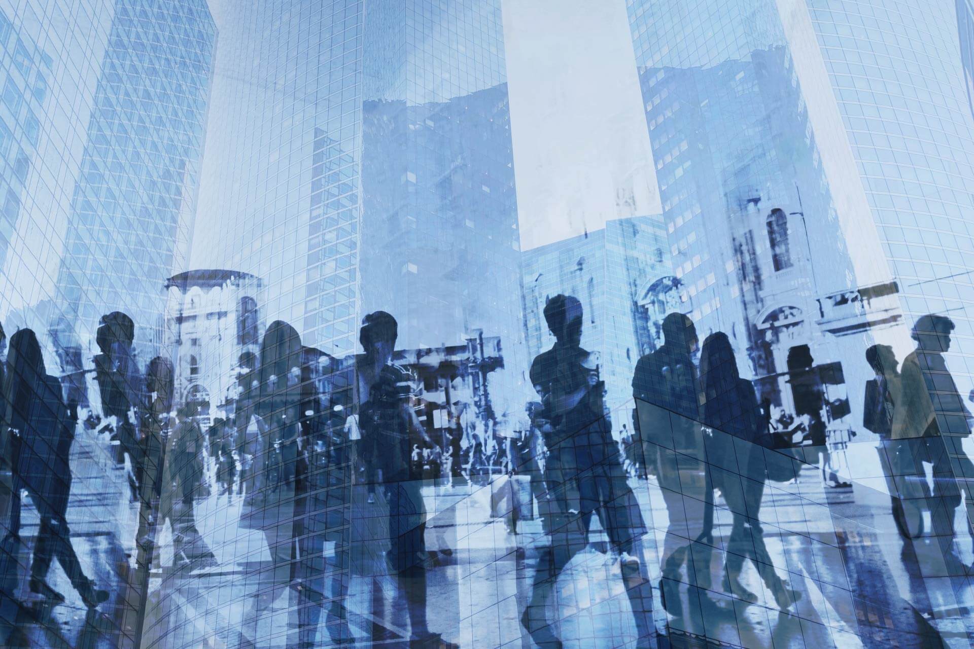 Silhouettes of commuters and city life blend into a tapestry of urban hustle amidst a backdrop of towering glass skyscrapers.