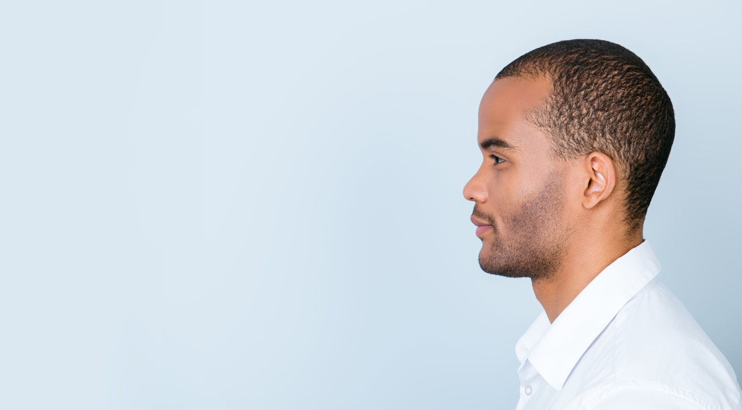 Focused Dark Skinned Man Side Facing