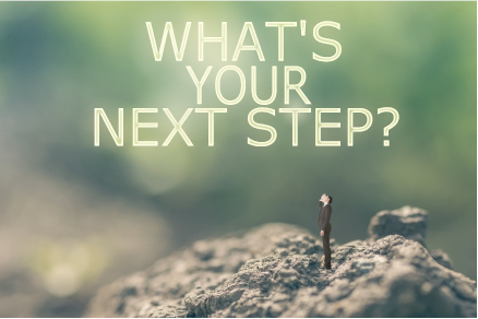 Man in a suit stands on rocky ground, looking up at the text "WHAT'S YOUR NEXT STEP?" against a green background.