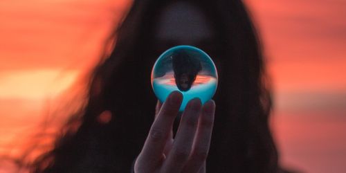 Woman holding reflective globe