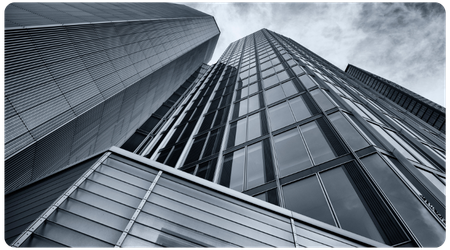 extreme angle from below a tall glass skyscraper