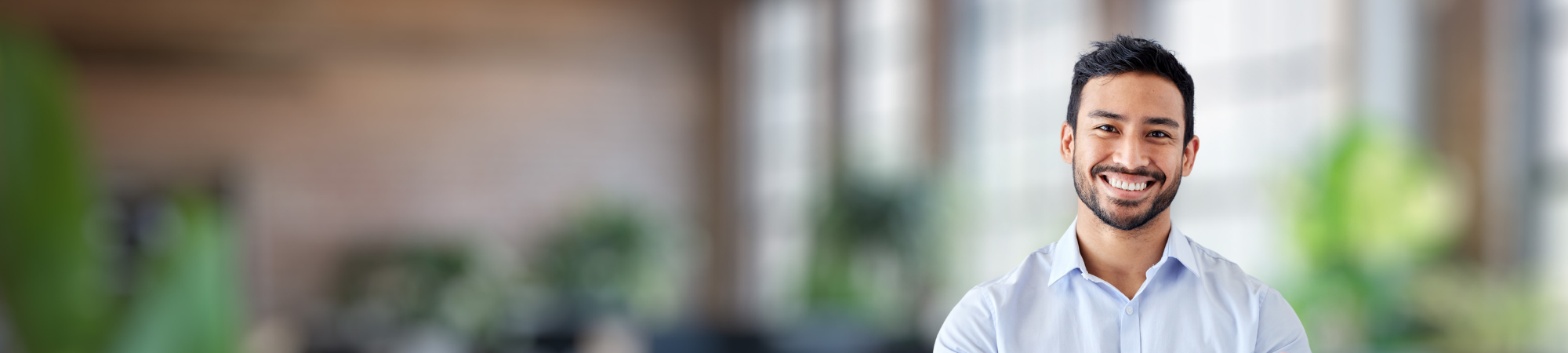 Services and Solutions Banner Image male professional in an office
