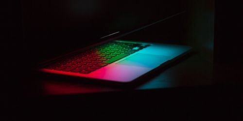 Half open neon laptop