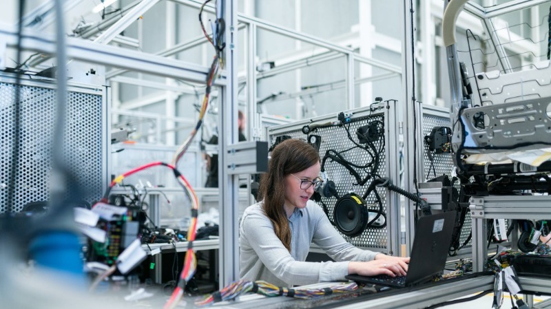 Photograph of Female Technician at Work