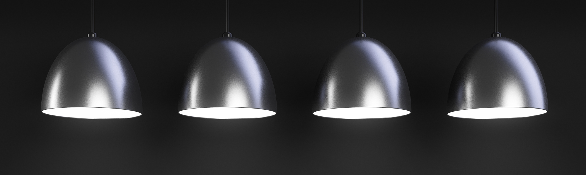 4 ceiling lamps lit on a dark background