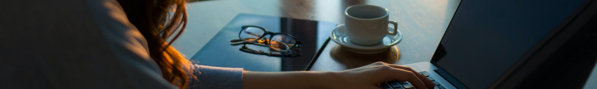 Cropped Woman Sending Email on Laptop at Desk