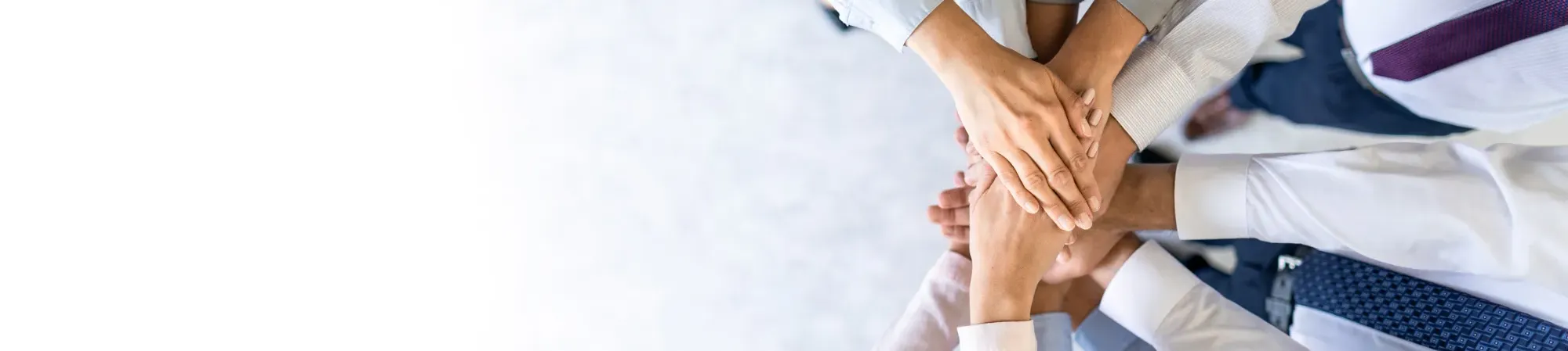 Group hand shake promoting teamwork