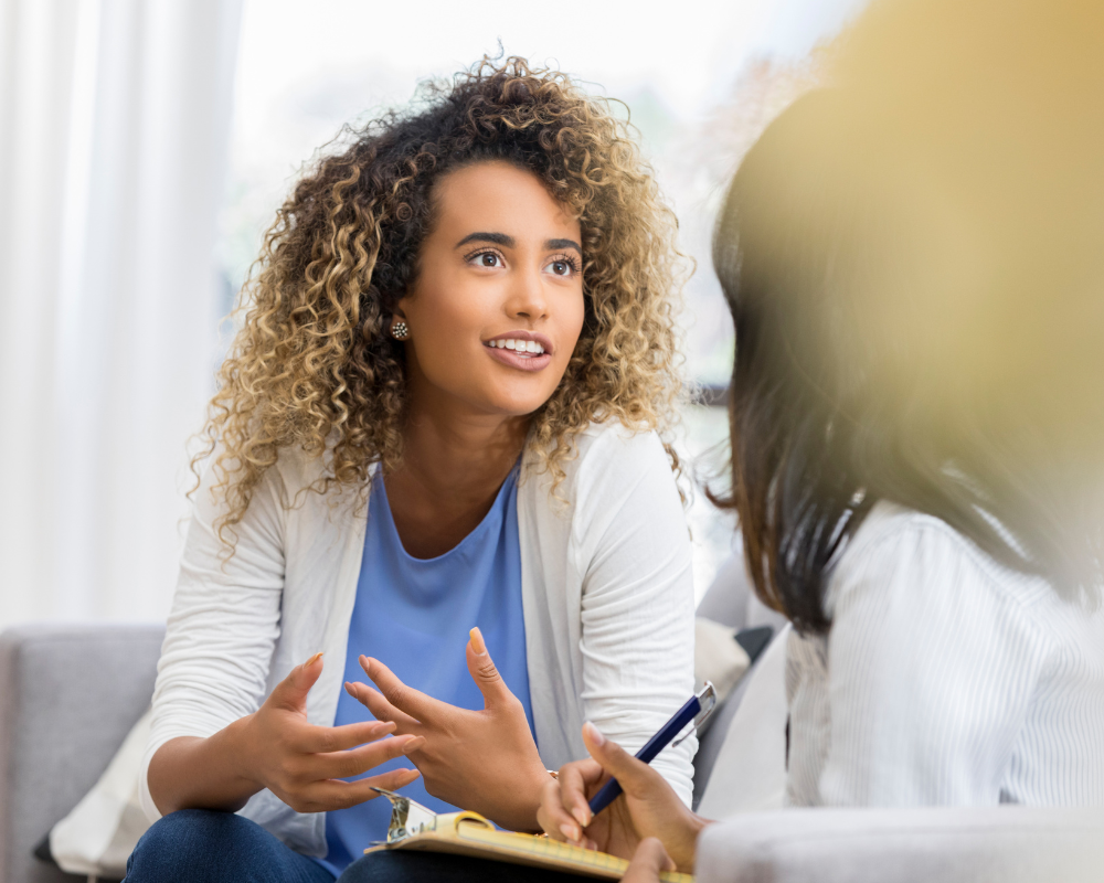 A woman talking to a mental health specialist.