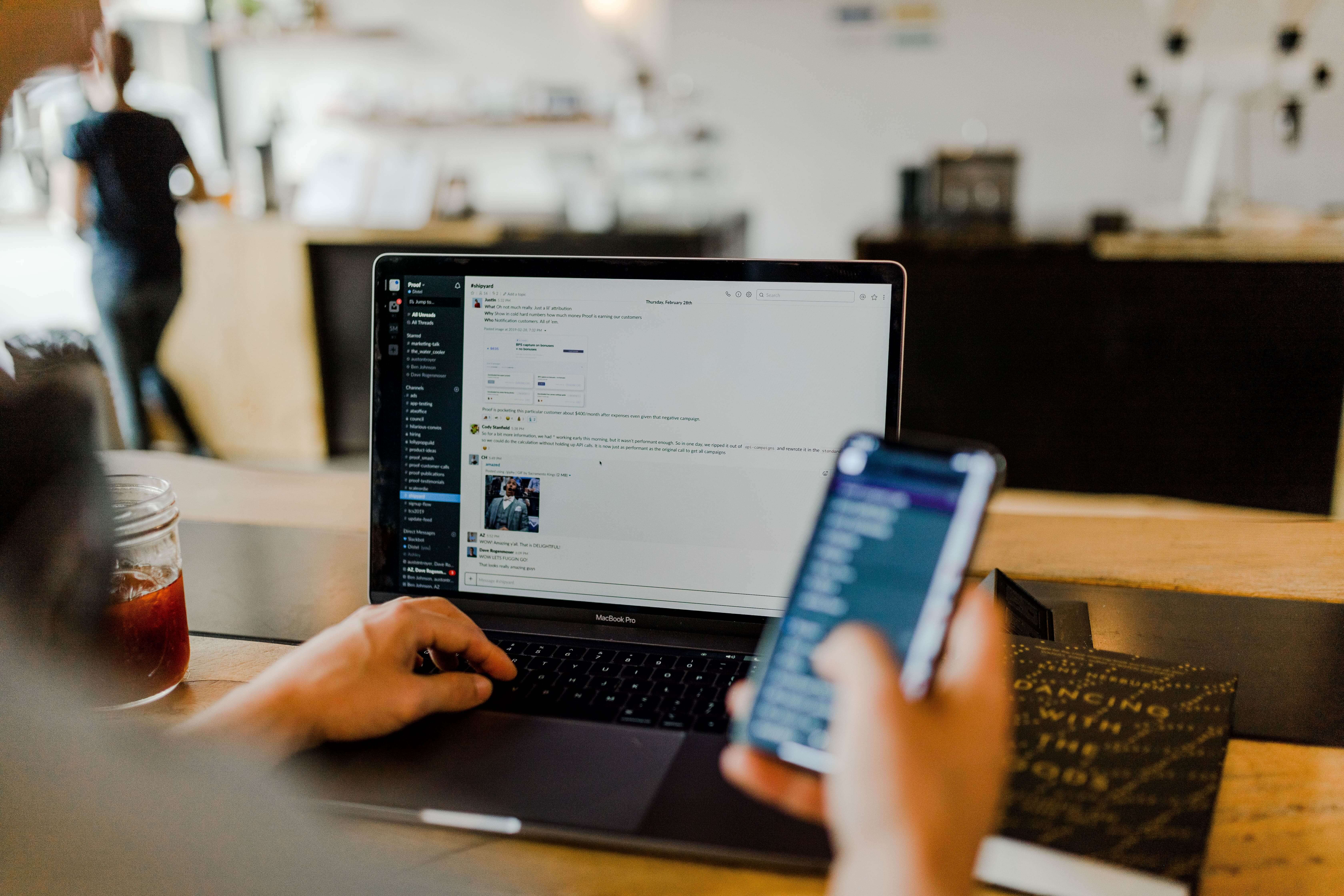 Man Using Phone Laptop To Chat