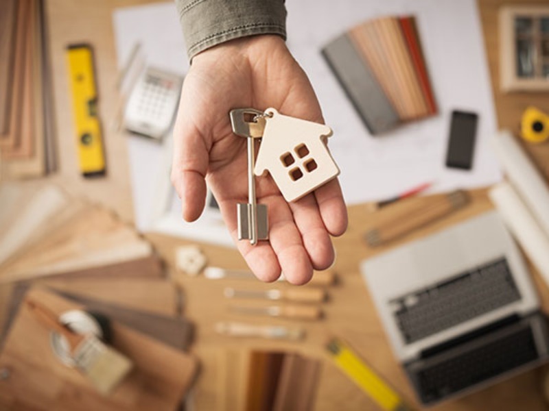 Person holding set of keys