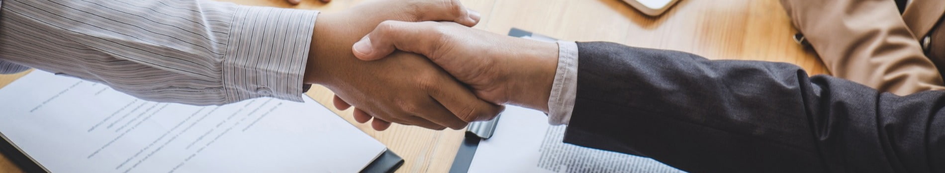 Interviewer shaking hands with interviewee after interview